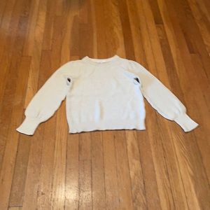 Cream colored sweater with gold flecks.